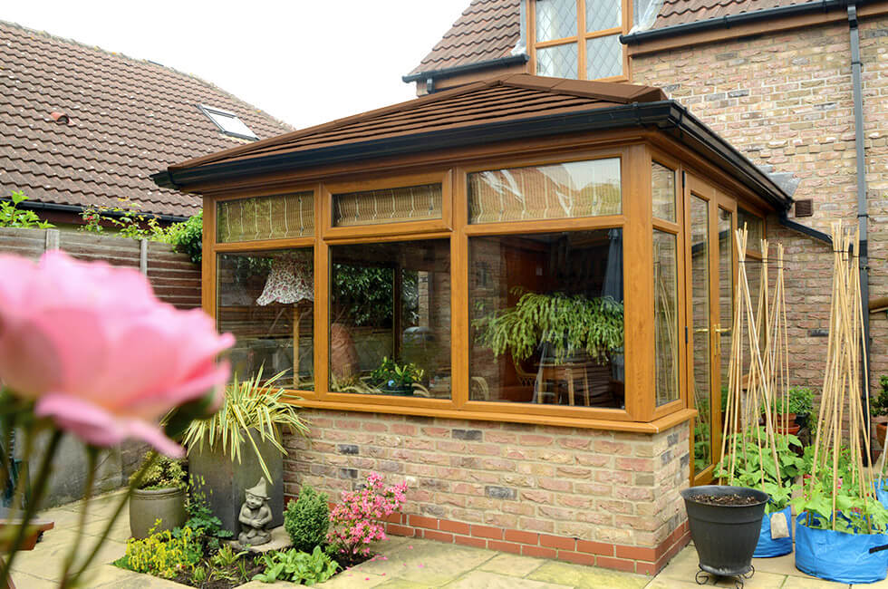 Golden Oak conservatory with a tiled roof