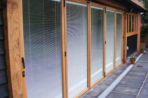 oak effect bifold doors with integral blinds