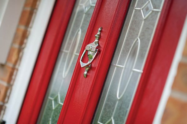 Red composite entrance door close up