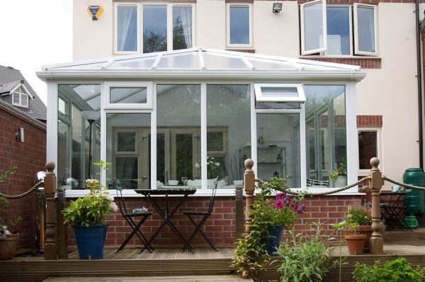 White uPVC Edwardian conservatory with a glass roof