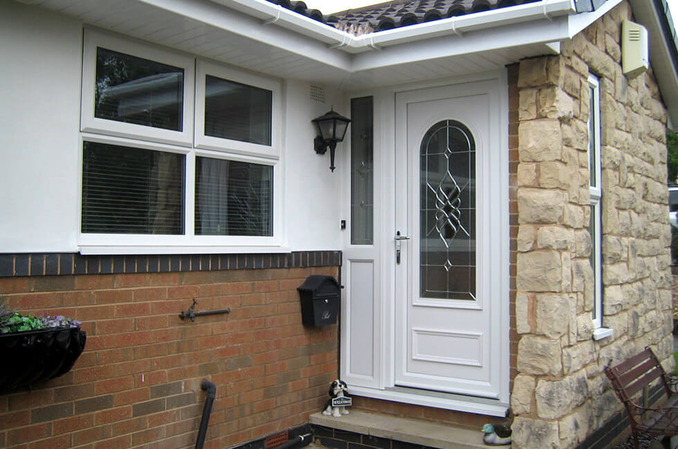 White uPVC entrance door with silver hardware