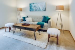 living room with coffee table and floor lamps